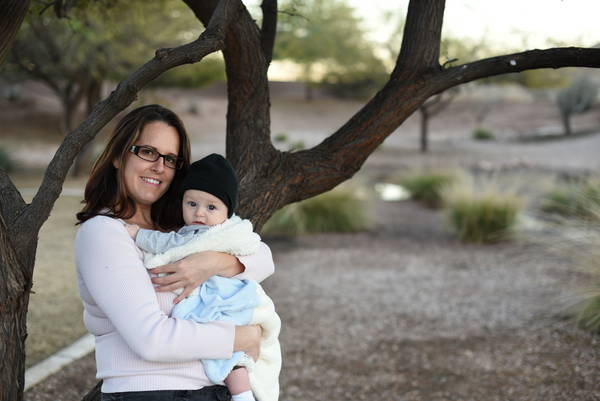 Jen and Remy posing by tree