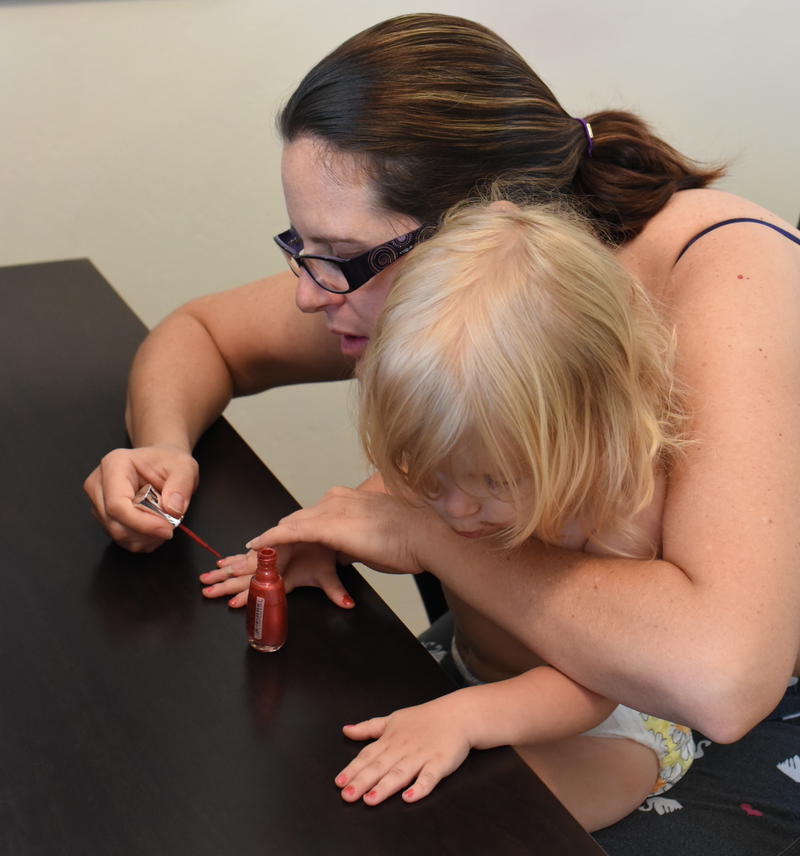 Mom painting Priya's nails