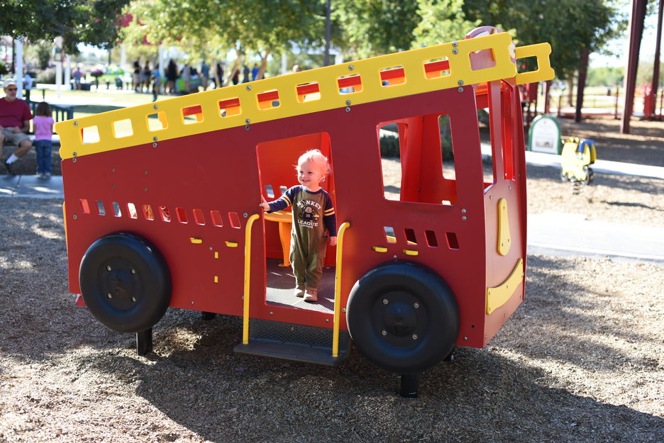 Remy on red bus at Playtopia