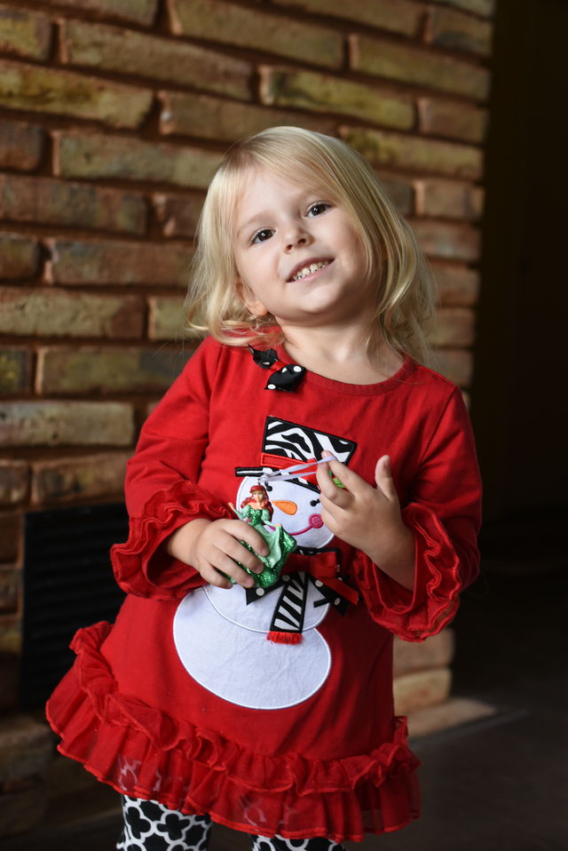 Priya holding her Ariel ornament