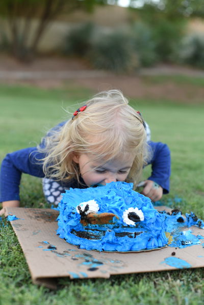 Priya diving face first into birthday cake