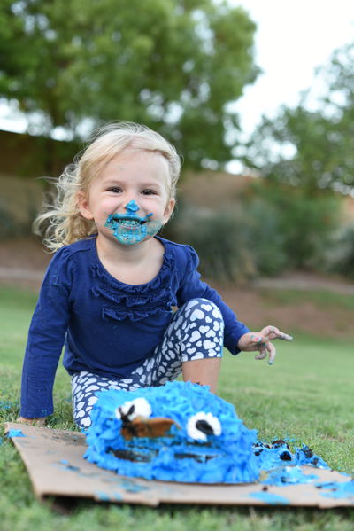 Priya with birthday cake all over her face