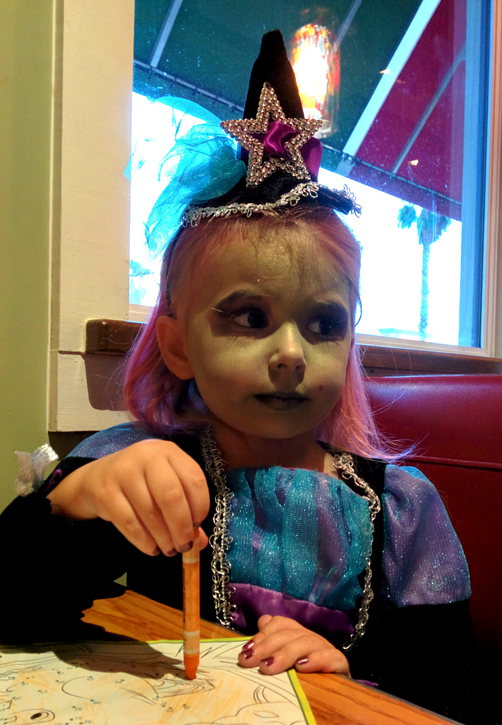 Priya in witch costume