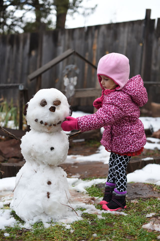 Priya making her first snowman