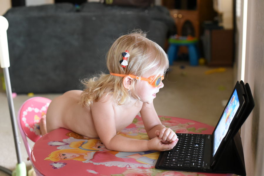 Priya watching iPad with goggles