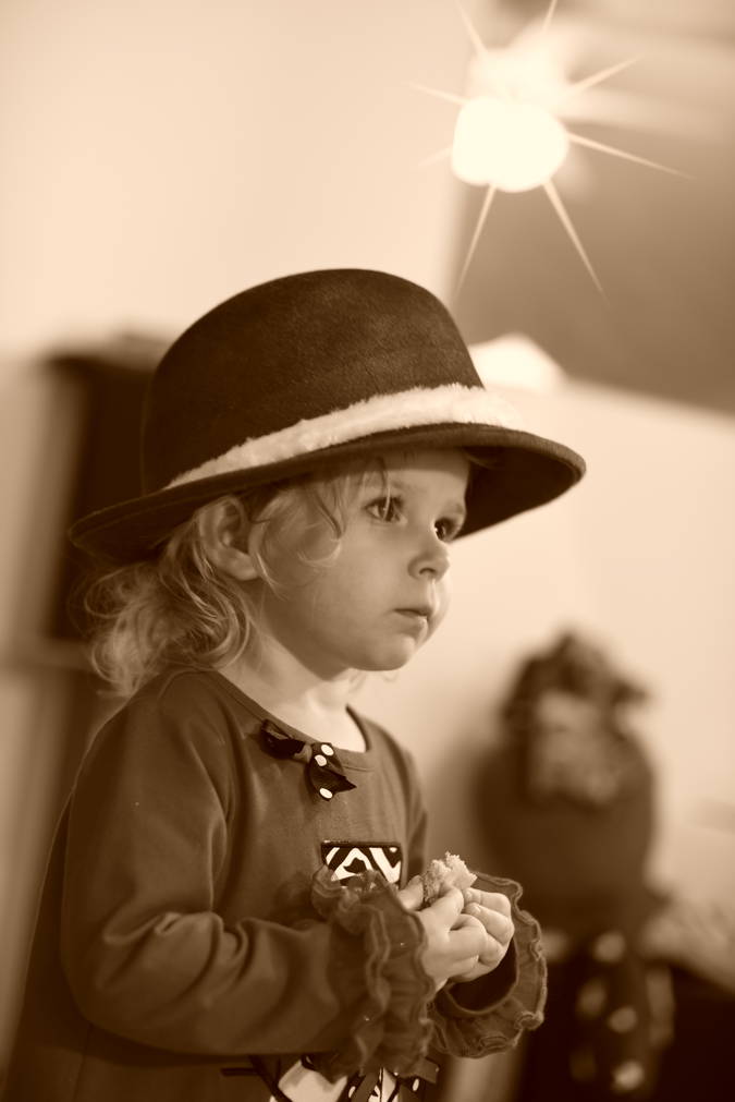 Priya wearing red fedora, picture in B/W