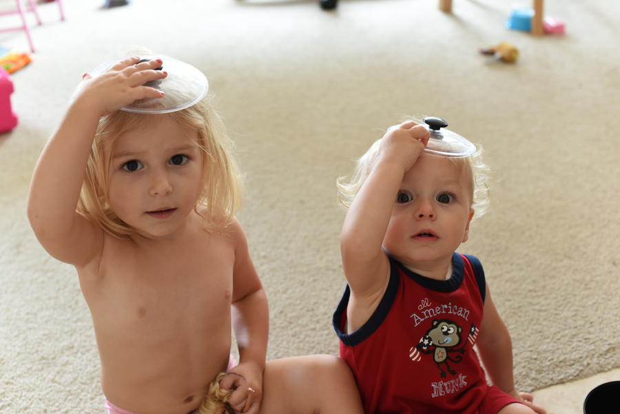 Remy & Priya wearing pot lids